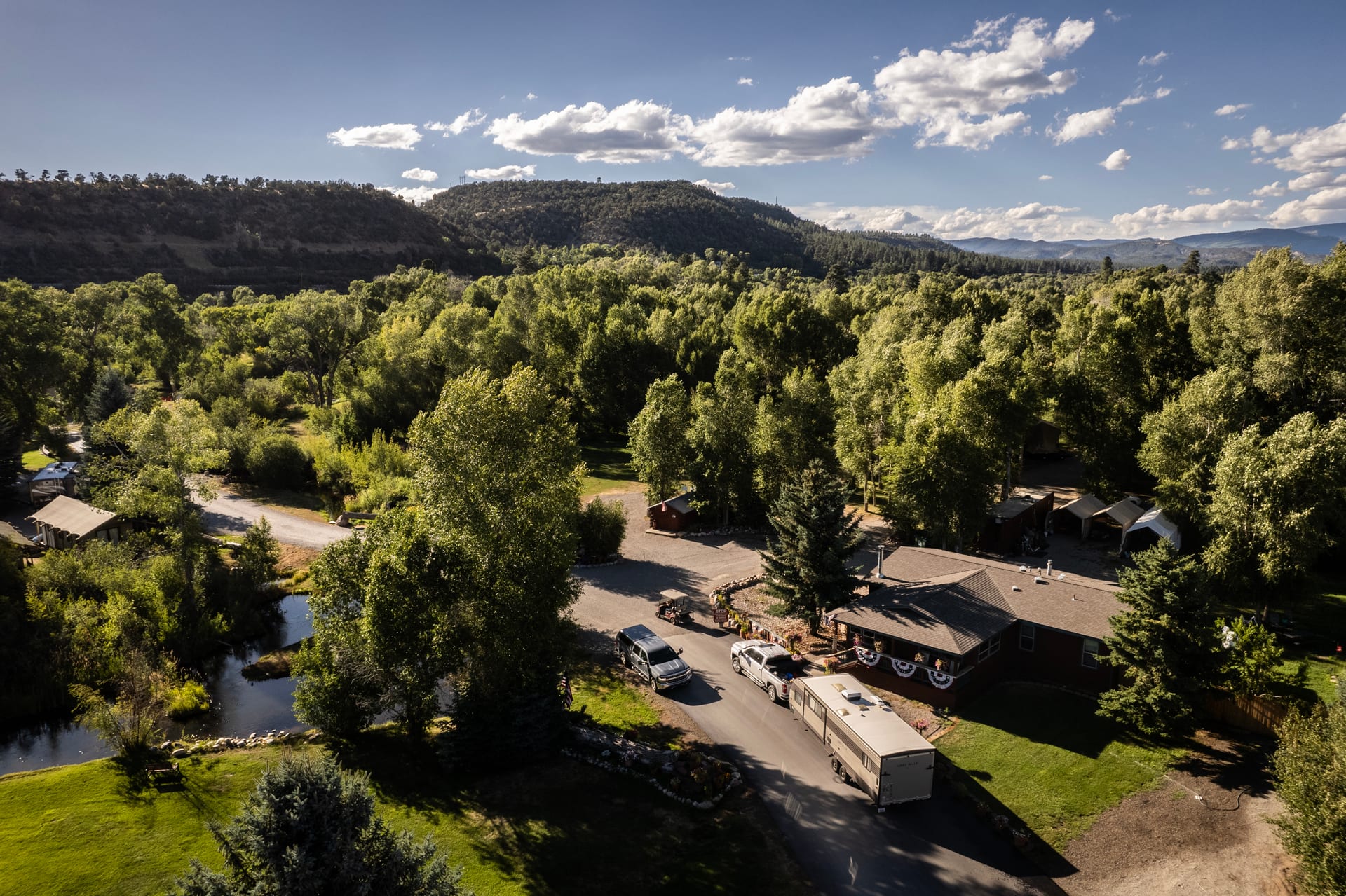 Aerial view of the entrance road into Outdoorsy Bayfield with an RV arriving